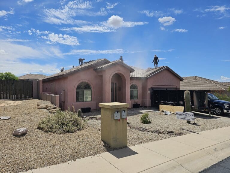 Weather Tite Exteriors Experts working on roof in Mesa AZ