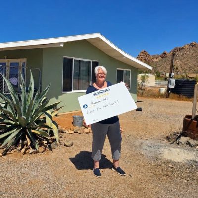 Happy Arizona Homeowner with new roof on her home